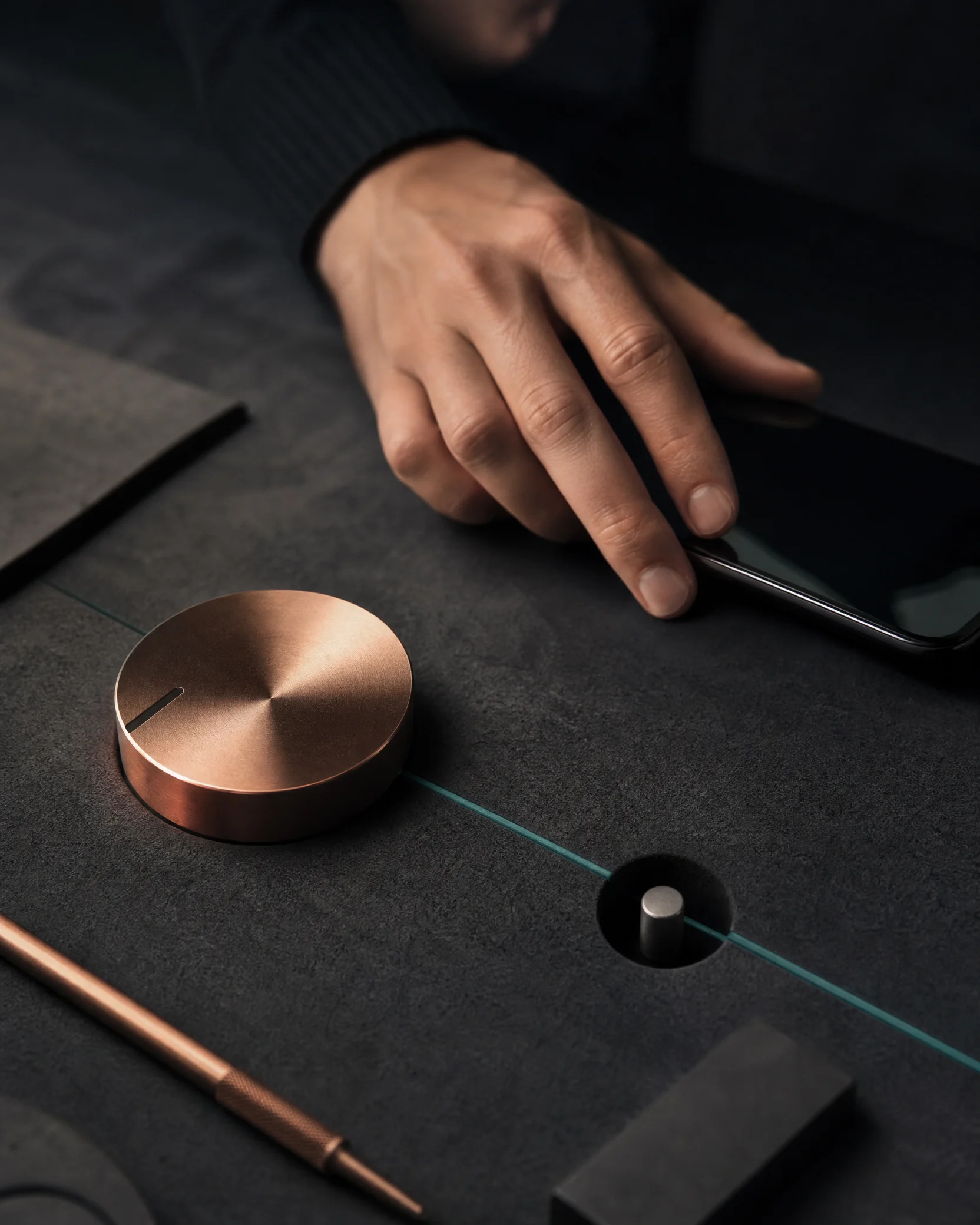 Hand tuning a mobile device near a copper dial